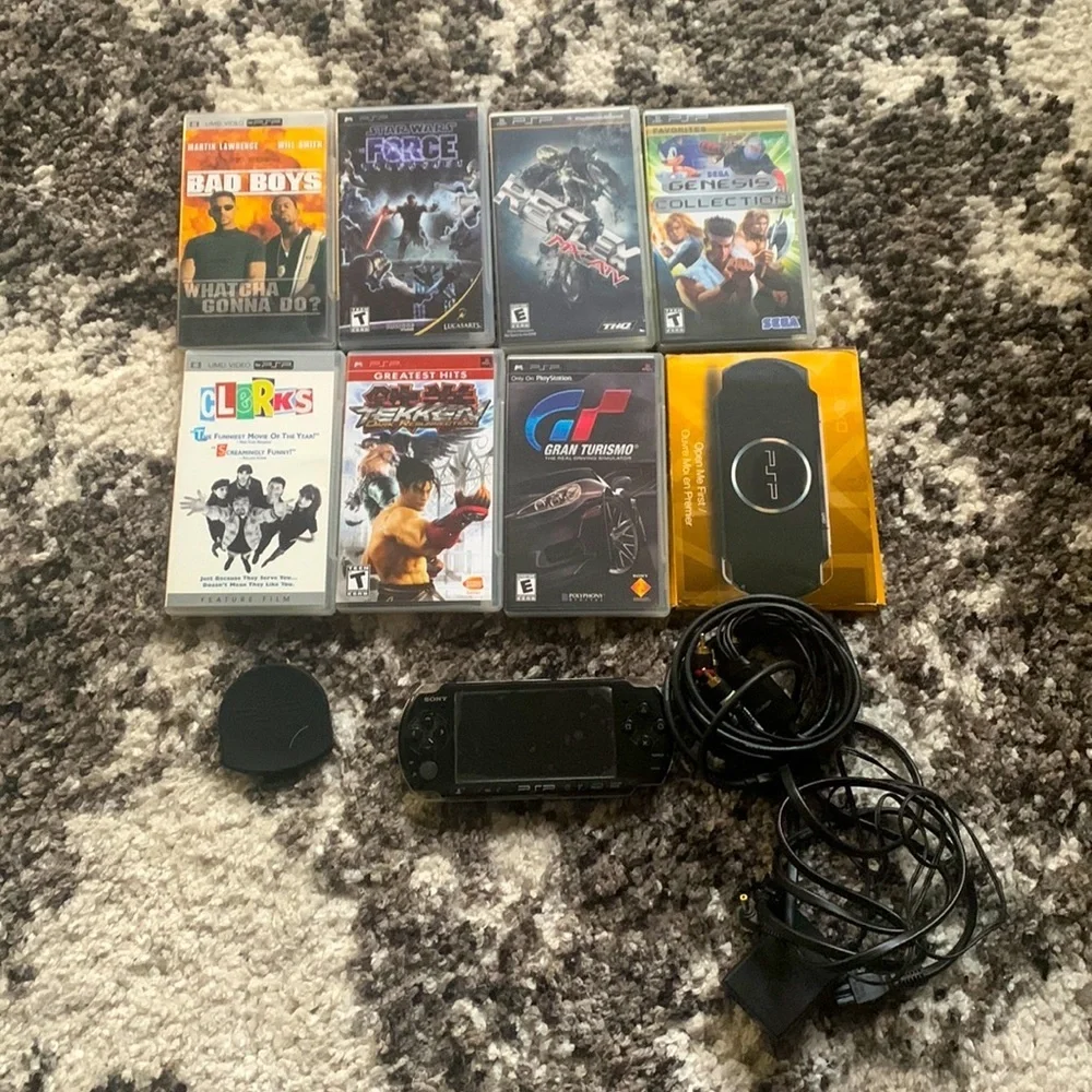 PSP Bundle with 7 games + case and extra disc holder and TV cables